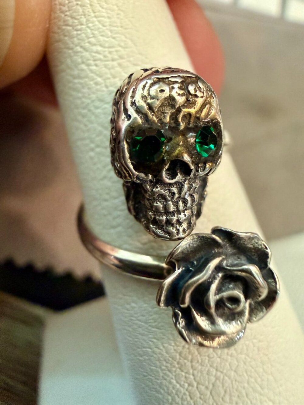 Dainty rose skull ring, sterling silver with green gemstone eyes.